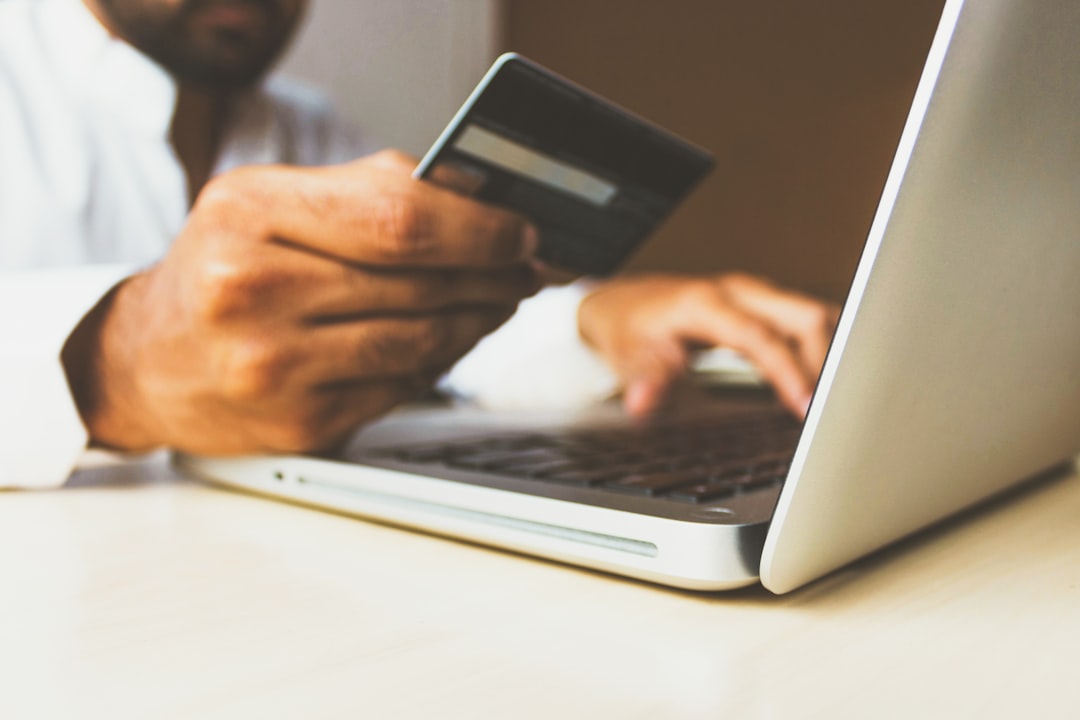 Freelancer reviewing overdue invoices and payment schedules on laptop computer