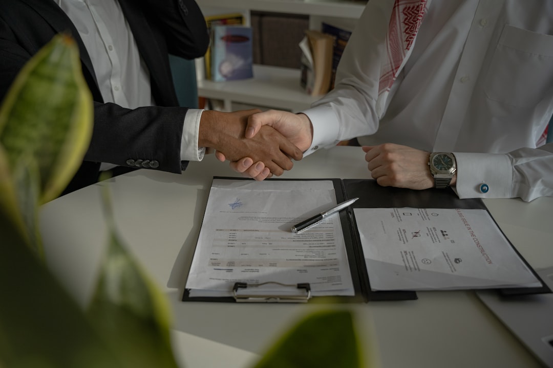 Freelancer reviewing a retainer agreement contract at a desk