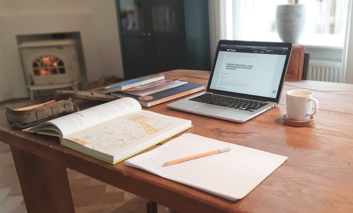 Freelancer's workspace with laptop, tools, and productivity apps