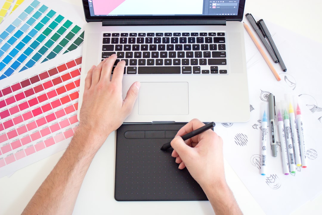 Freelance web designer reviewing a client contract at their desk